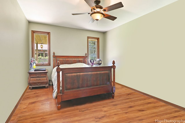 bedroom featuring light hardwood / wood-style flooring and ceiling fan