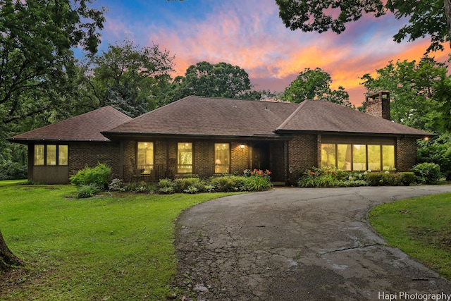 prairie-style home featuring a yard