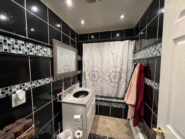 bathroom with tasteful backsplash, vanity, and tile walls