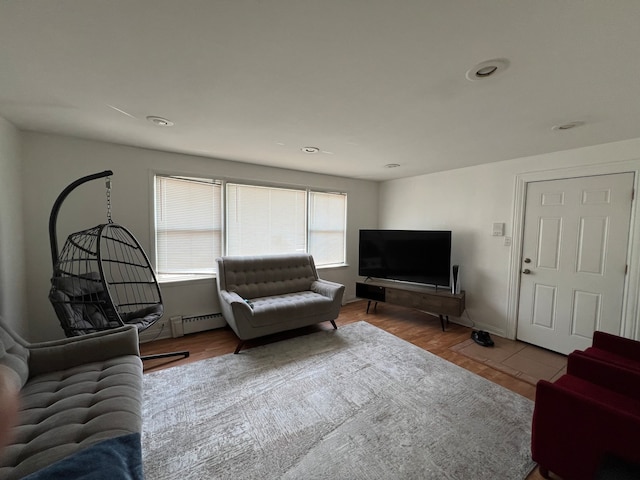 living room featuring hardwood / wood-style floors and baseboard heating