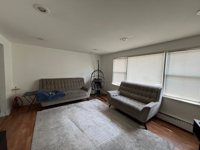 living room featuring hardwood / wood-style floors and a baseboard radiator