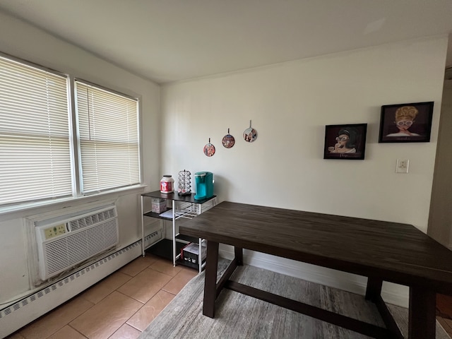 dining room featuring a baseboard heating unit and light tile patterned floors