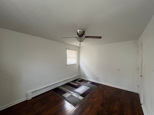 unfurnished room with ceiling fan, hardwood / wood-style flooring, and baseboard heating