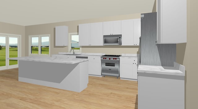 kitchen with built in fridge, light wood-type flooring, and white cabinetry