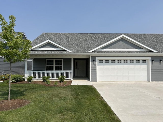 1109 S 2nd St, Oregon, IL 61061 - view of front of home featuring a shingled roof, concrete driveway, an attached garage, a front lawn, and a porch