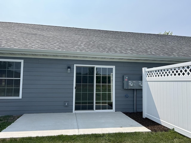 1109 S 2nd St, Oregon, IL 61061 - rear view of property featuring a shingled roof and a patio area
