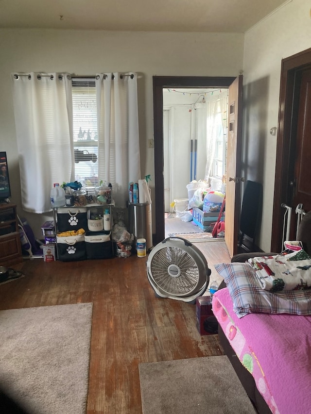 bedroom with dark wood-type flooring