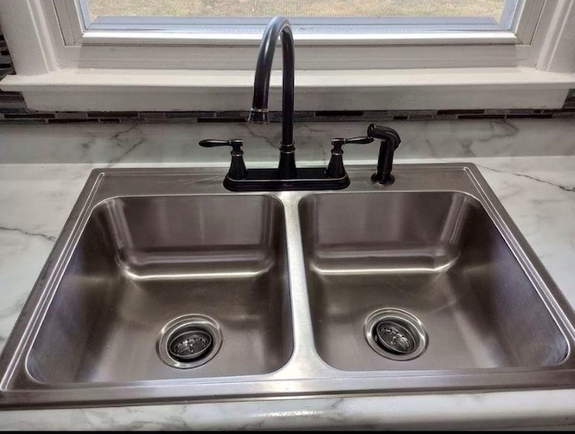 details with sink and light stone countertops