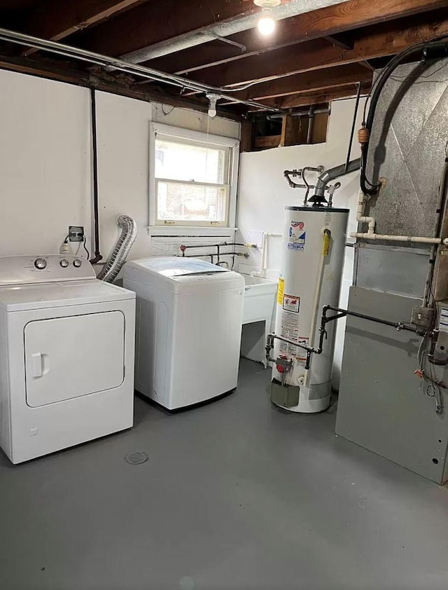 washroom with heating unit, separate washer and dryer, and water heater