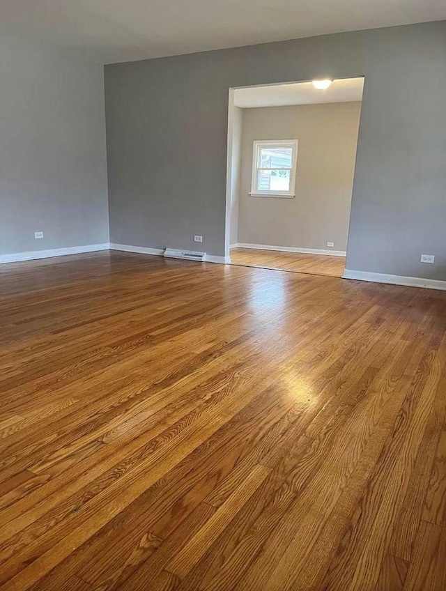 unfurnished room featuring light hardwood / wood-style flooring