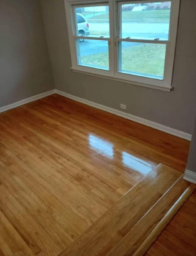 empty room featuring hardwood / wood-style flooring