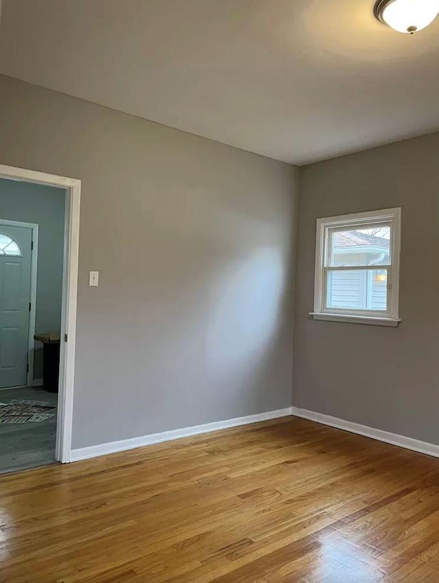 unfurnished room featuring light hardwood / wood-style floors