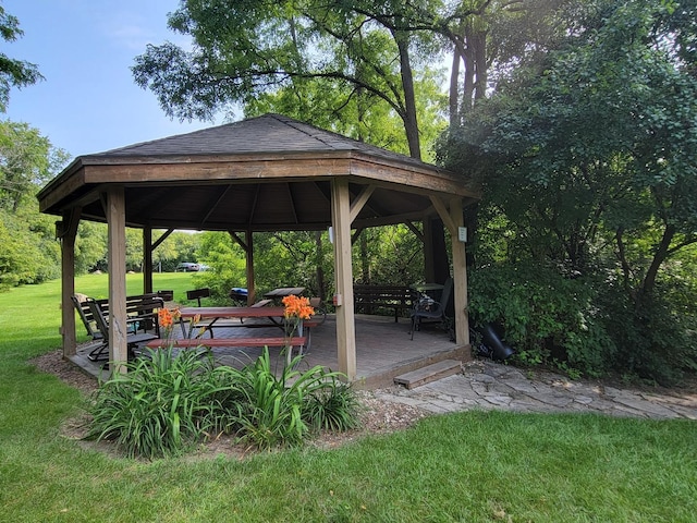 exterior space with a gazebo, a yard, and a wooden deck