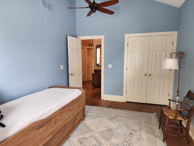 bedroom featuring a closet, ceiling fan, hardwood / wood-style flooring, and lofted ceiling