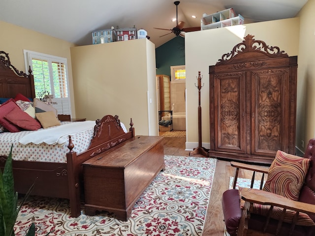 bedroom with light hardwood / wood-style flooring and lofted ceiling