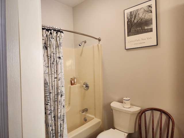 bathroom with toilet and shower / bath combo with shower curtain