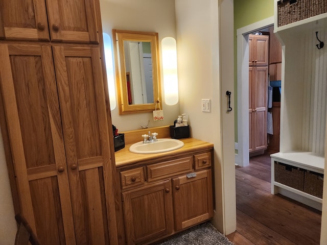 bathroom with vanity and hardwood / wood-style floors