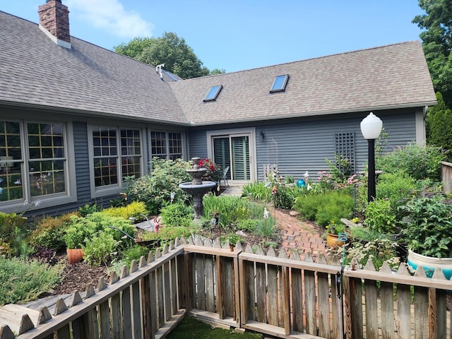 1726 Georgetown Dr, Champaign, IL 61821 - back of house with a shingled roof and a chimney