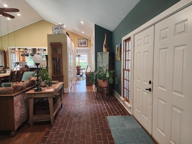 1726 Georgetown Dr, Champaign, IL 61821 - entryway featuring lofted ceiling, brick floors, ceiling fan, recessed lighting, and baseboards