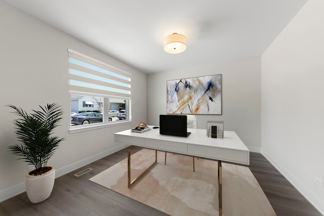 office space with dark hardwood / wood-style flooring