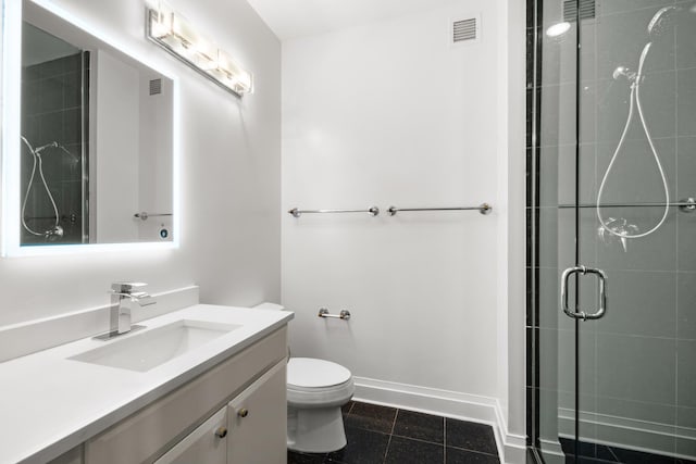 full bathroom featuring a stall shower, baseboards, visible vents, toilet, and vanity