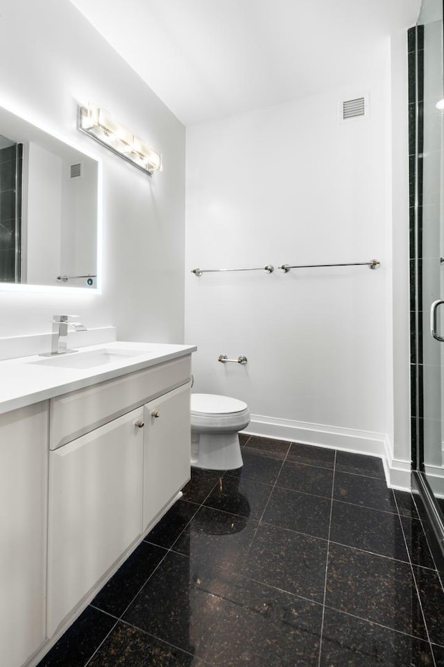 bathroom with a stall shower, visible vents, baseboards, vanity, and granite finish floor