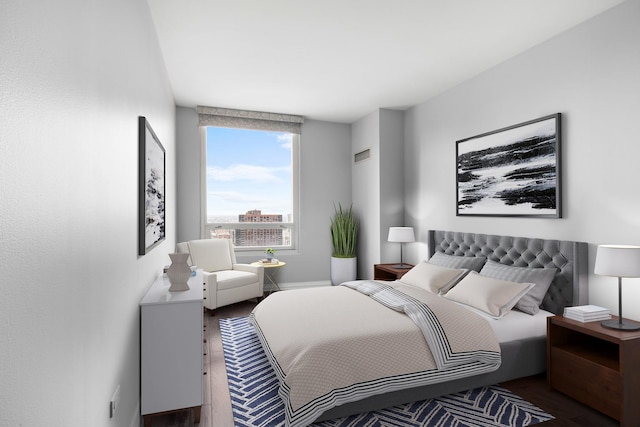 bedroom featuring wood finished floors