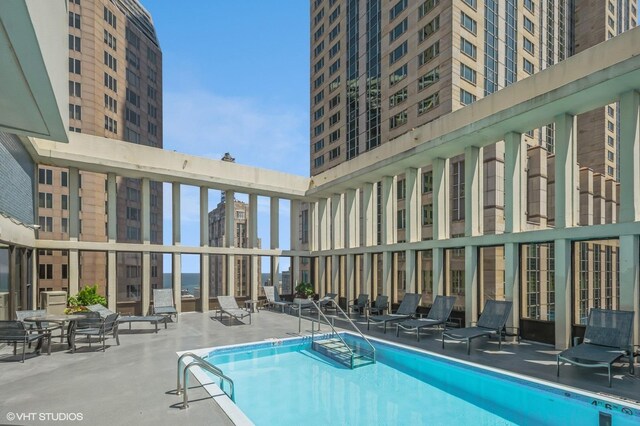 view of swimming pool featuring a patio