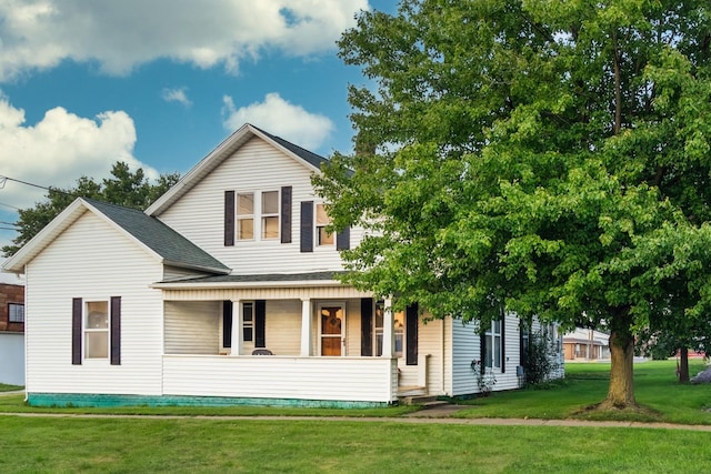 view of front of house featuring a front lawn and a porch