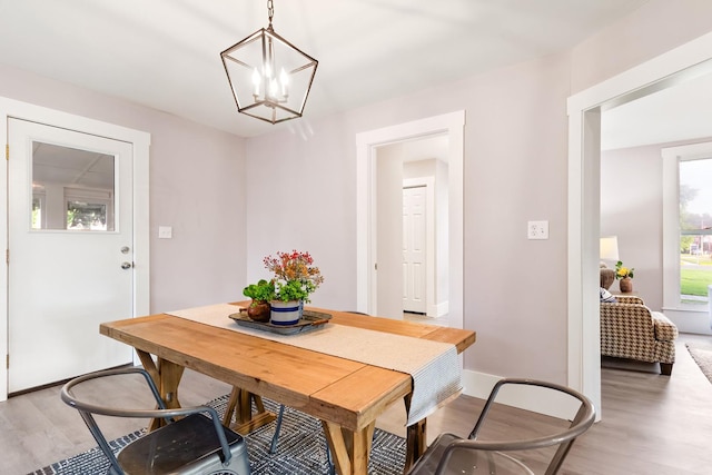 dining room featuring a notable chandelier and wood-type flooring