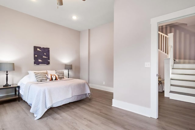 bedroom featuring wood-type flooring and ceiling fan