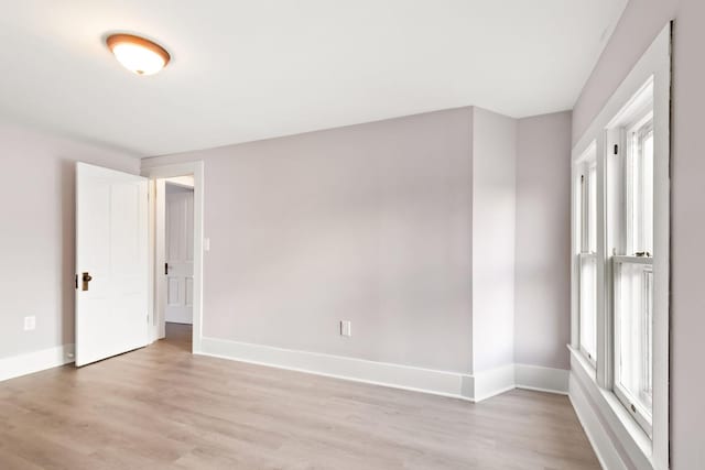 empty room with light hardwood / wood-style floors