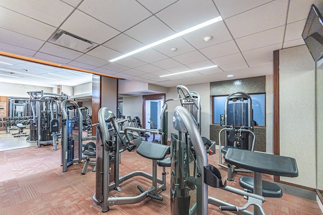 gym featuring a drop ceiling