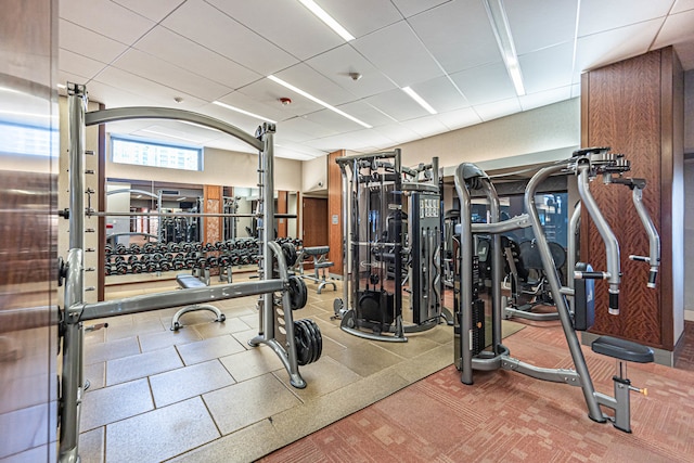 gym featuring a drop ceiling