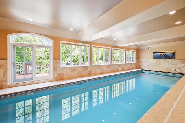 view of swimming pool with a jacuzzi