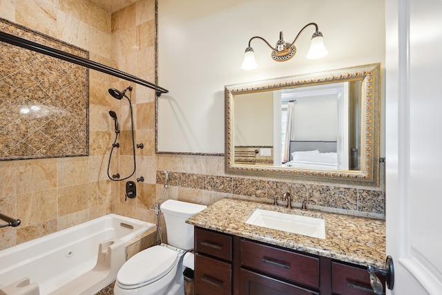 full bathroom featuring tile walls, toilet, tiled shower / bath combo, and vanity