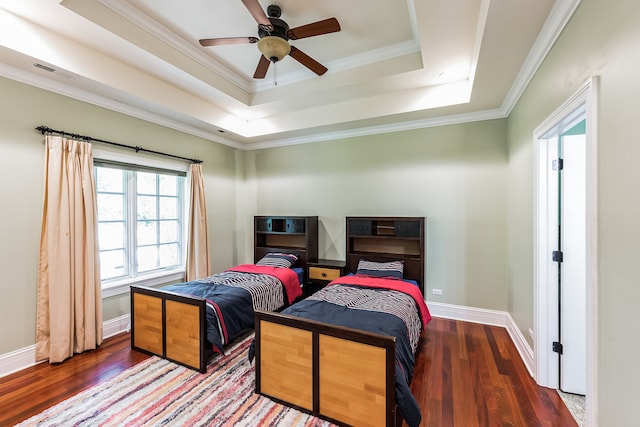 bedroom with wood-type flooring, crown molding, a raised ceiling, and ceiling fan