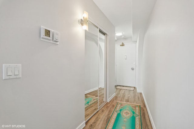 corridor featuring light hardwood / wood-style floors