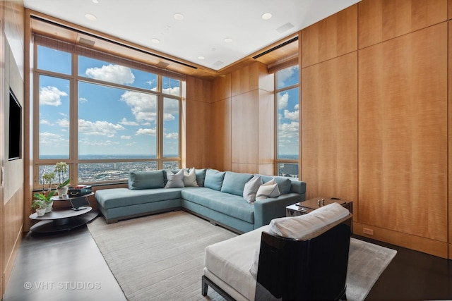 living room with a wall of windows and recessed lighting