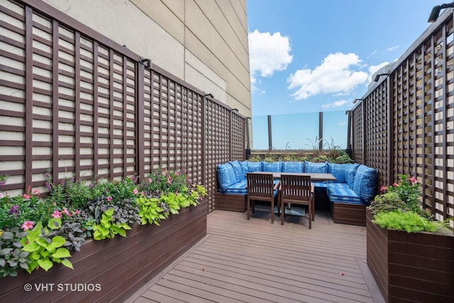 wooden deck with an outdoor hangout area