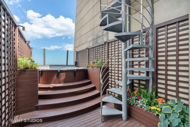 exterior space with a hot tub