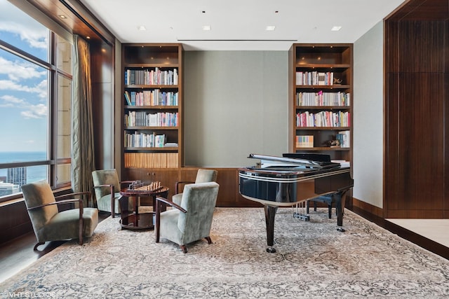 living area with built in features and wood finished floors