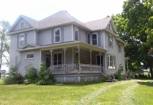 view of front facade featuring a porch and a front yard