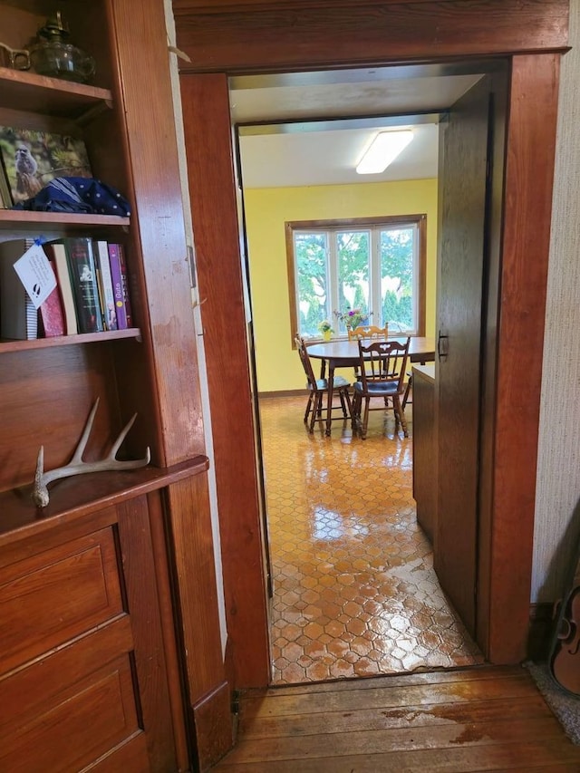 hall with wood-type flooring