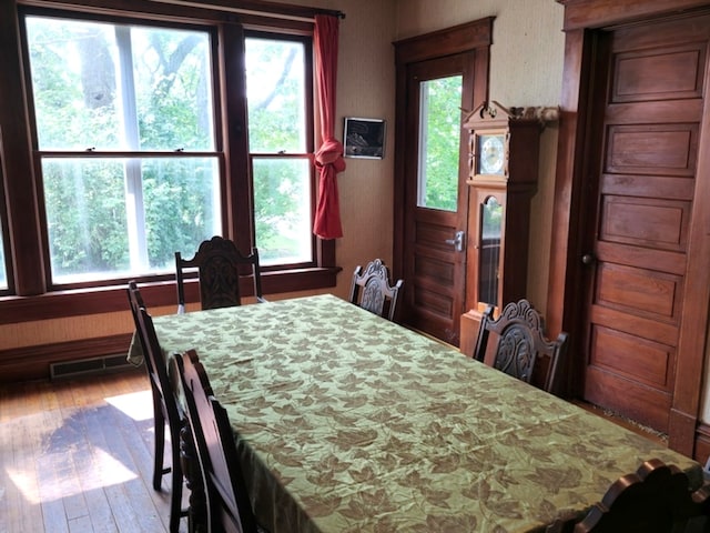 dining area with wood-type flooring