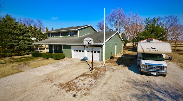 view of front of house featuring a garage and driveway