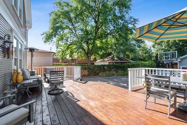 wooden terrace with an outdoor hangout area