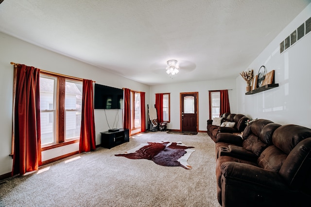 living room with light carpet and ceiling fan