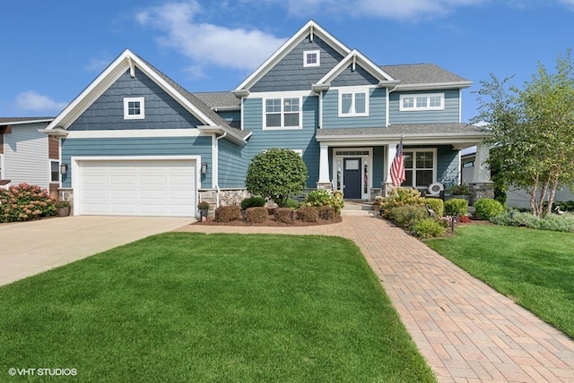 craftsman-style home featuring a garage and a front lawn