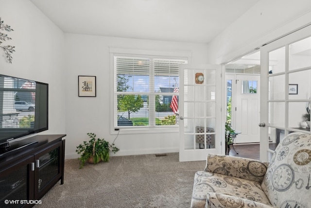 living room with carpet flooring and french doors